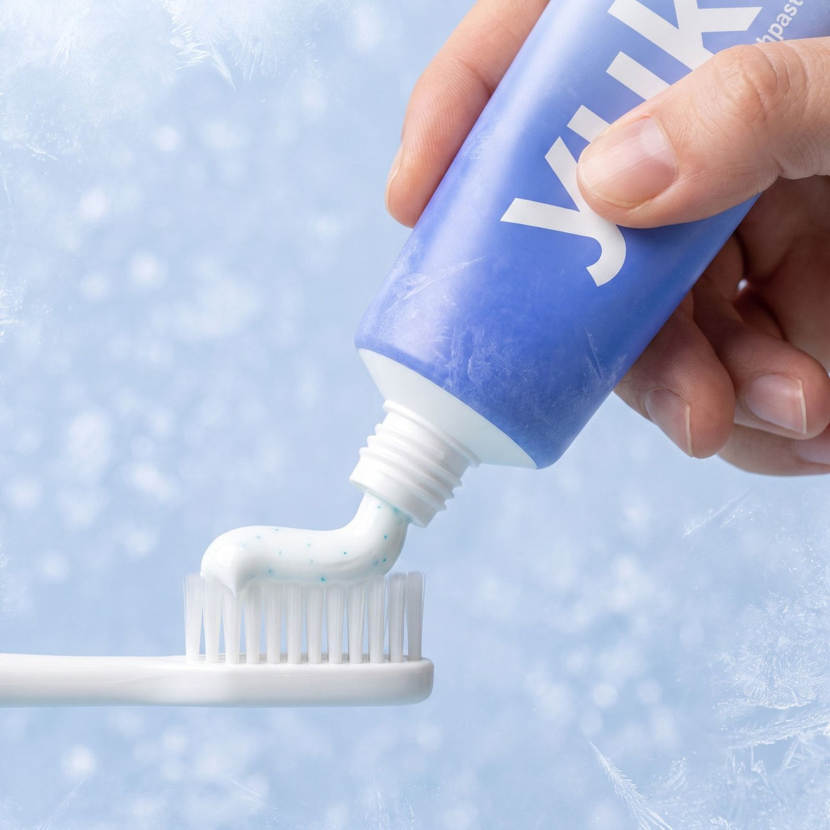 yuki remineralizing toothpaste on a toothbrush